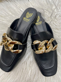 Black mule with gold chain embellishment