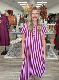 Raspberry Rush Dress – bold pink and burgundy striped dress featuring a relaxed silhouette, collared neckline, and chic gold button detailing.