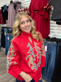 Crimson Plaid Statement Blouse - vibrant red long-sleeve blouse featuring bold plaid appliqué embroidery, a ruffled collar, and button-front detailing