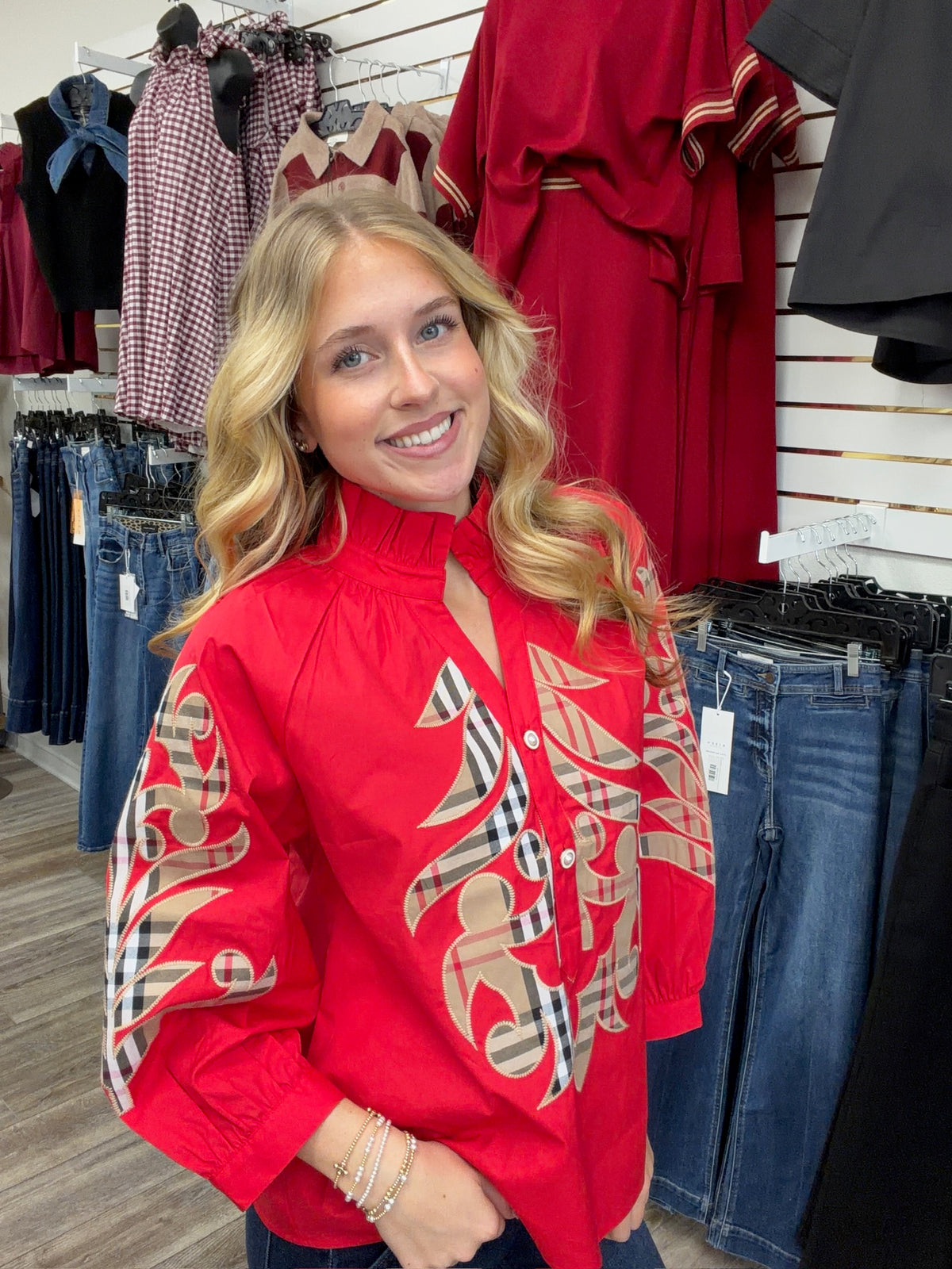 Crimson Plaid Statement Blouse - vibrant red long-sleeve blouse featuring bold plaid appliqué embroidery, a ruffled collar, and button-front detailing