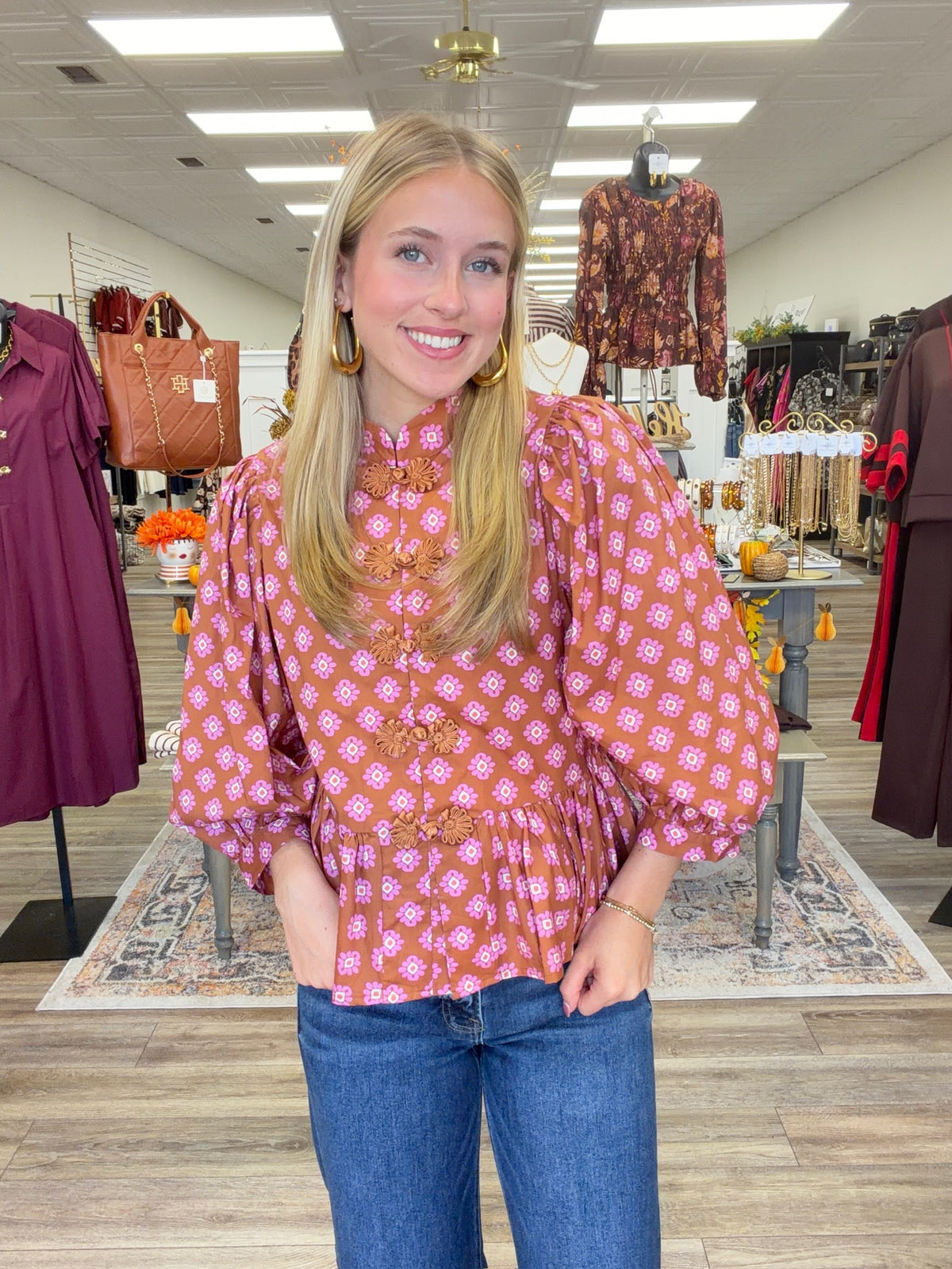 The Katy top - long sleeve, ruffled bottom, and statement button detail