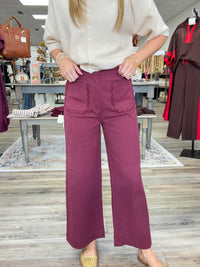 The Willow Scallop Wide Leg Pant features a wide leg with a signature scalloped front patch pocket detail and decorative non-functional back pockets.