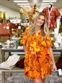 Golden Hour Garden Dress - vibrant mustard floral dress featuring a relaxed silhouette and bold blooms in warm orange, yellow, peach, and chocolate tones.