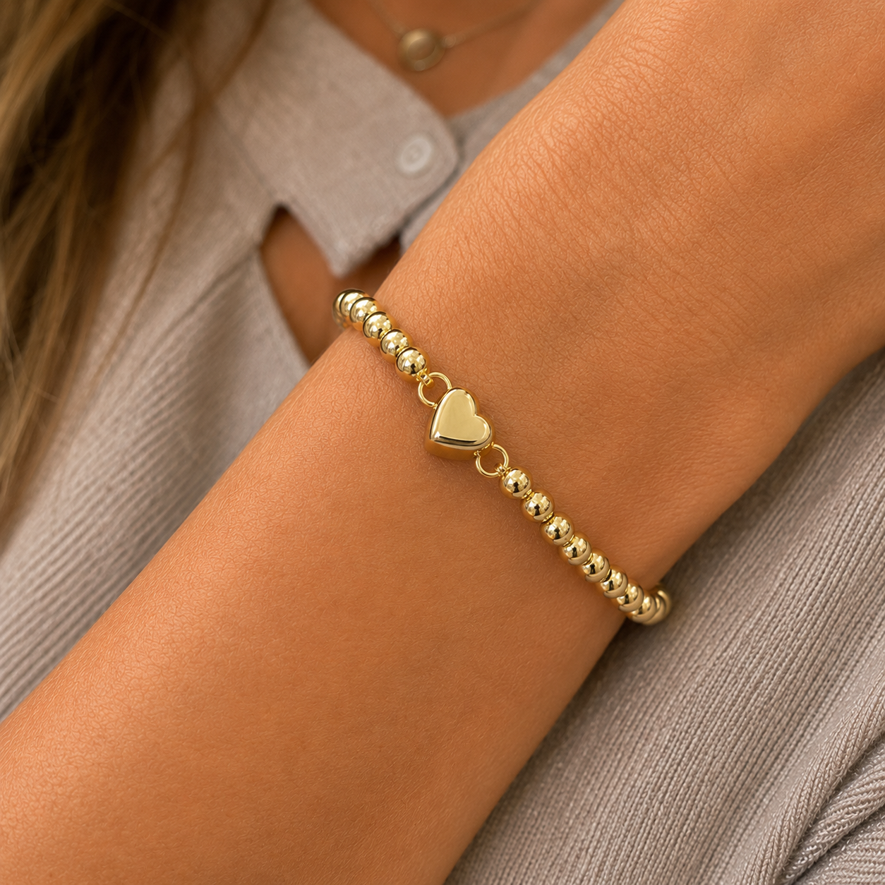 Stretch beaded stackable gold bracelet with heart accent– steel 18 karat gold overlay