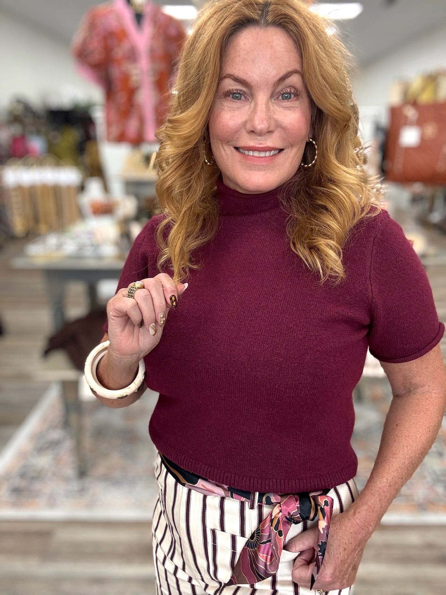 The Cabernet Cloud Mock Neck Knit Top. Ultra- soft knit features a relaxed silhouette, cozy mock neckline, and stylish drop shoulders.