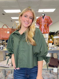 The juniper top - Forest green wrap-style blouse with a pointed collar, scalloped trim, and voluminous balloon sleeves with tie cuffs