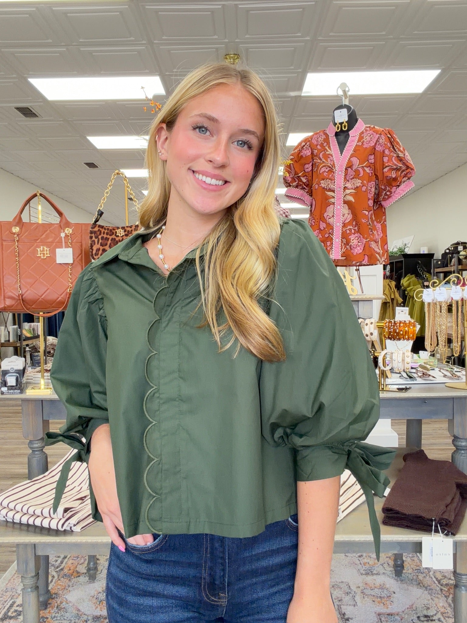 The juniper top - Forest green wrap-style blouse with a pointed collar, scalloped trim, and voluminous balloon sleeves with tie cuffs