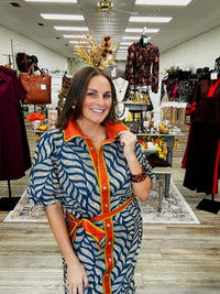 Golden Fern dress - navy leaf-print dress featuring a bold rust-orange collar and button-front trim with olive green accents
