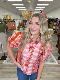 Pink Pumpkin Spice Top - Vibrant pink and orange printed top featuring a playful mix of stripes and geometric patterns, statement puff sleeves, and feminine ruffle detailing.