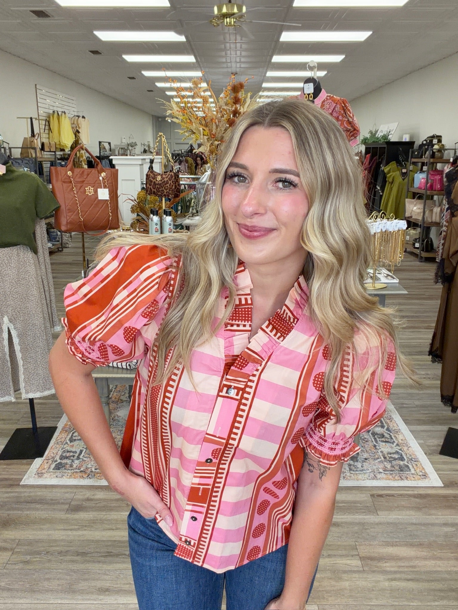 Pink Pumpkin Spice Top - Vibrant pink and orange printed top featuring a playful mix of stripes and geometric patterns, statement puff sleeves, and feminine ruffle detailing.