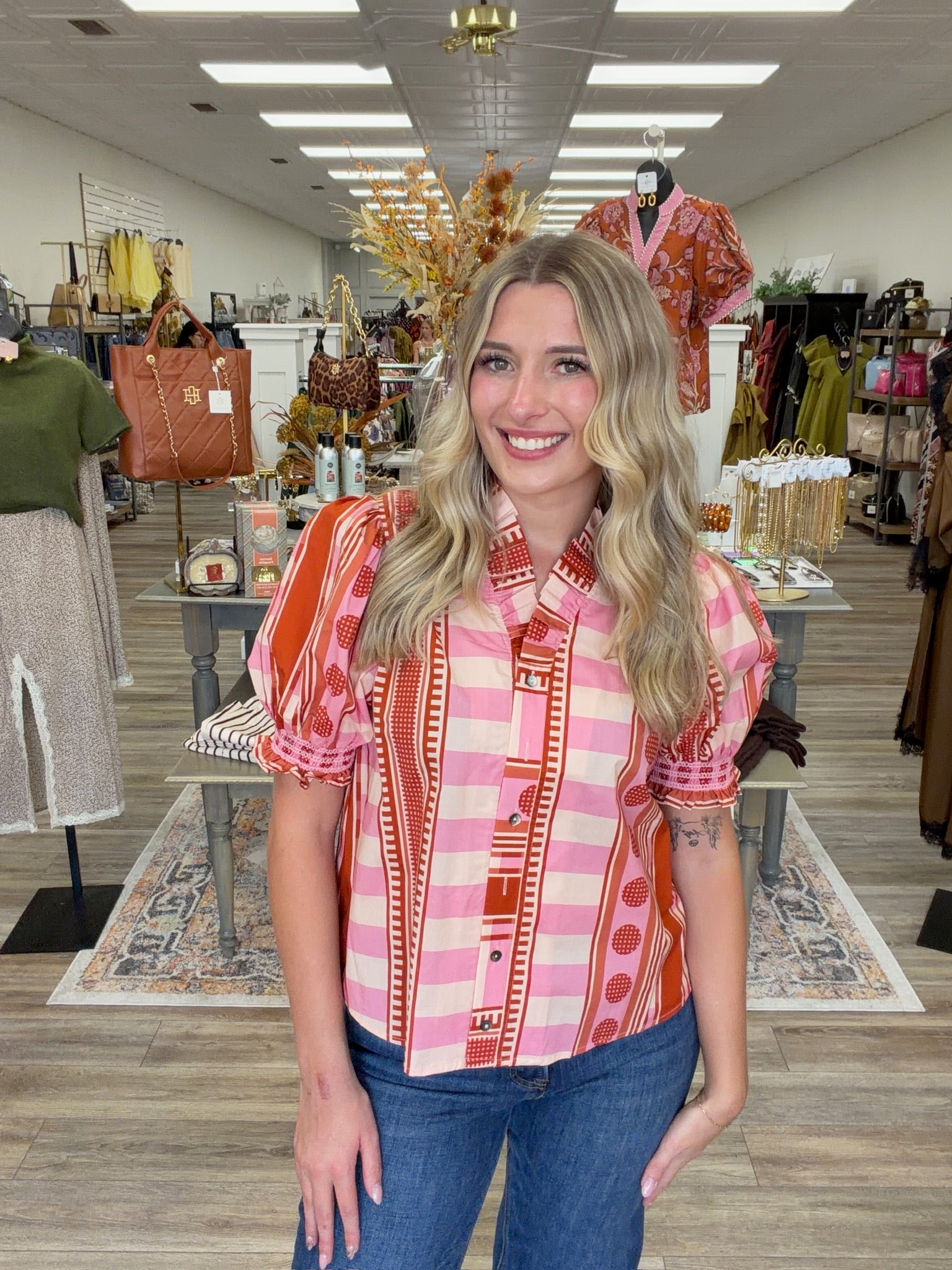 Pink Pumpkin Spice Top - Vibrant pink and orange printed top featuring a playful mix of stripes and geometric patterns, statement puff sleeves, and feminine ruffle detailing.