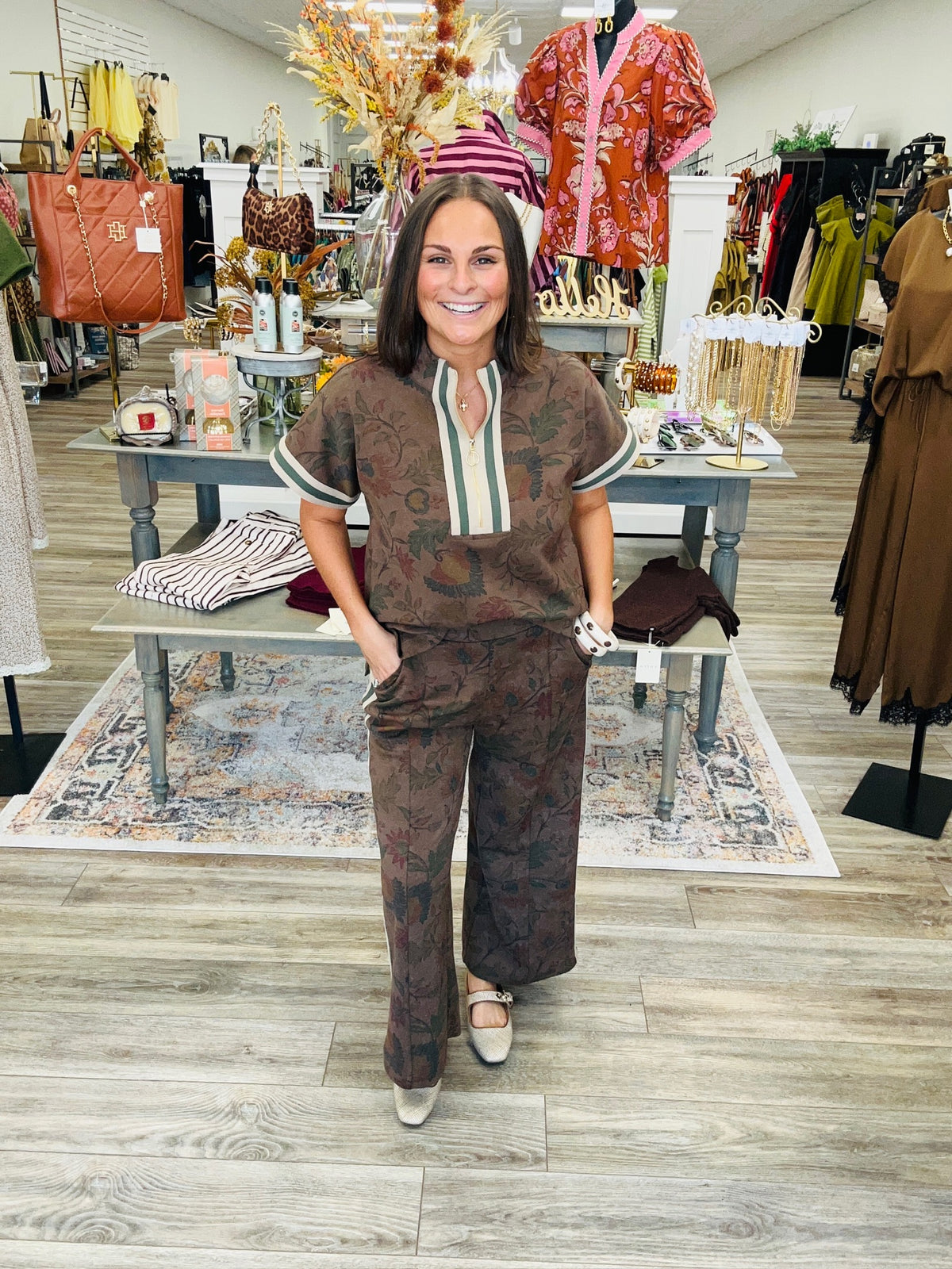 Vintage Garden Luxe Set featuring a soft, stretchy printed dark mocha knit fabric with a smooth, luxurious feel, mock neckline, and a relaxed short sleeve half zip top with striped ribbon detailing