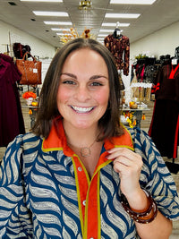 Golden Fern dress - navy leaf-print dress featuring a bold rust-orange collar and button-front trim with olive green accents