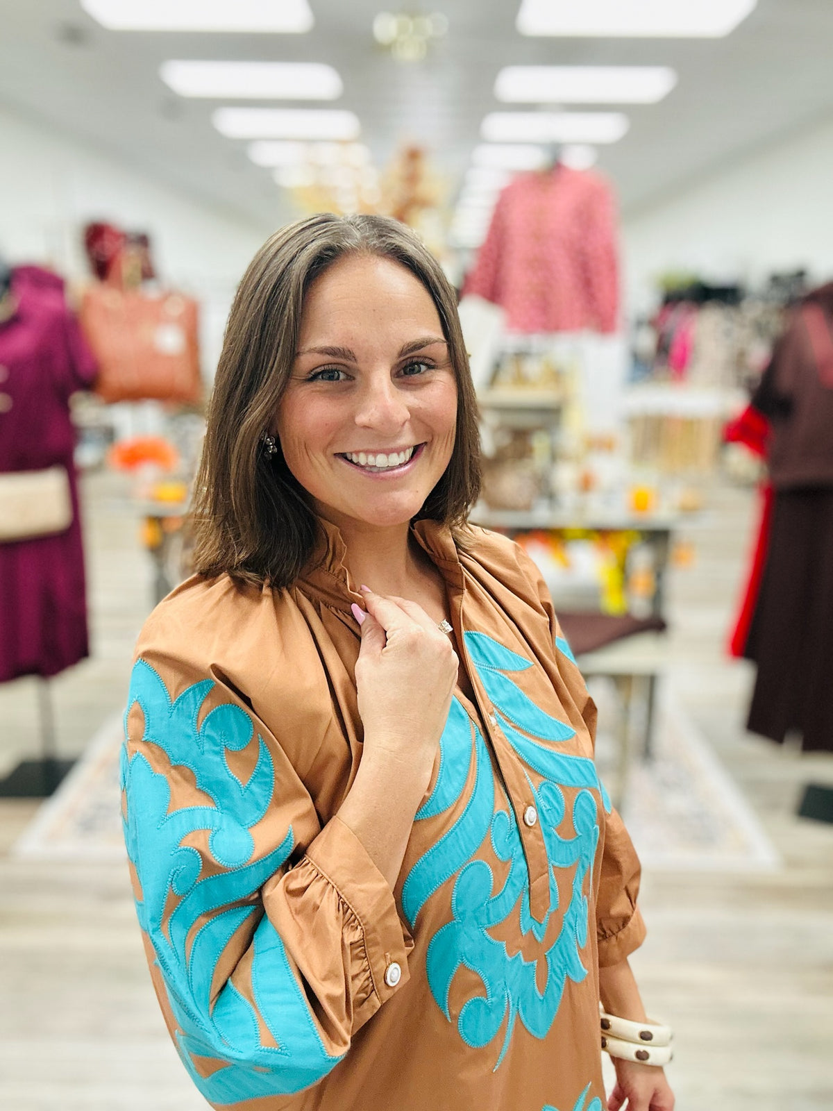 The Jolene dress - This camel-brown dress features beautiful turquoise appliqué detailing on the front, 3:4 sleeve