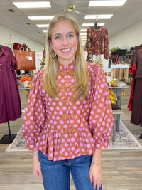 The Katy top - long sleeve, ruffled bottom, and statement button detail