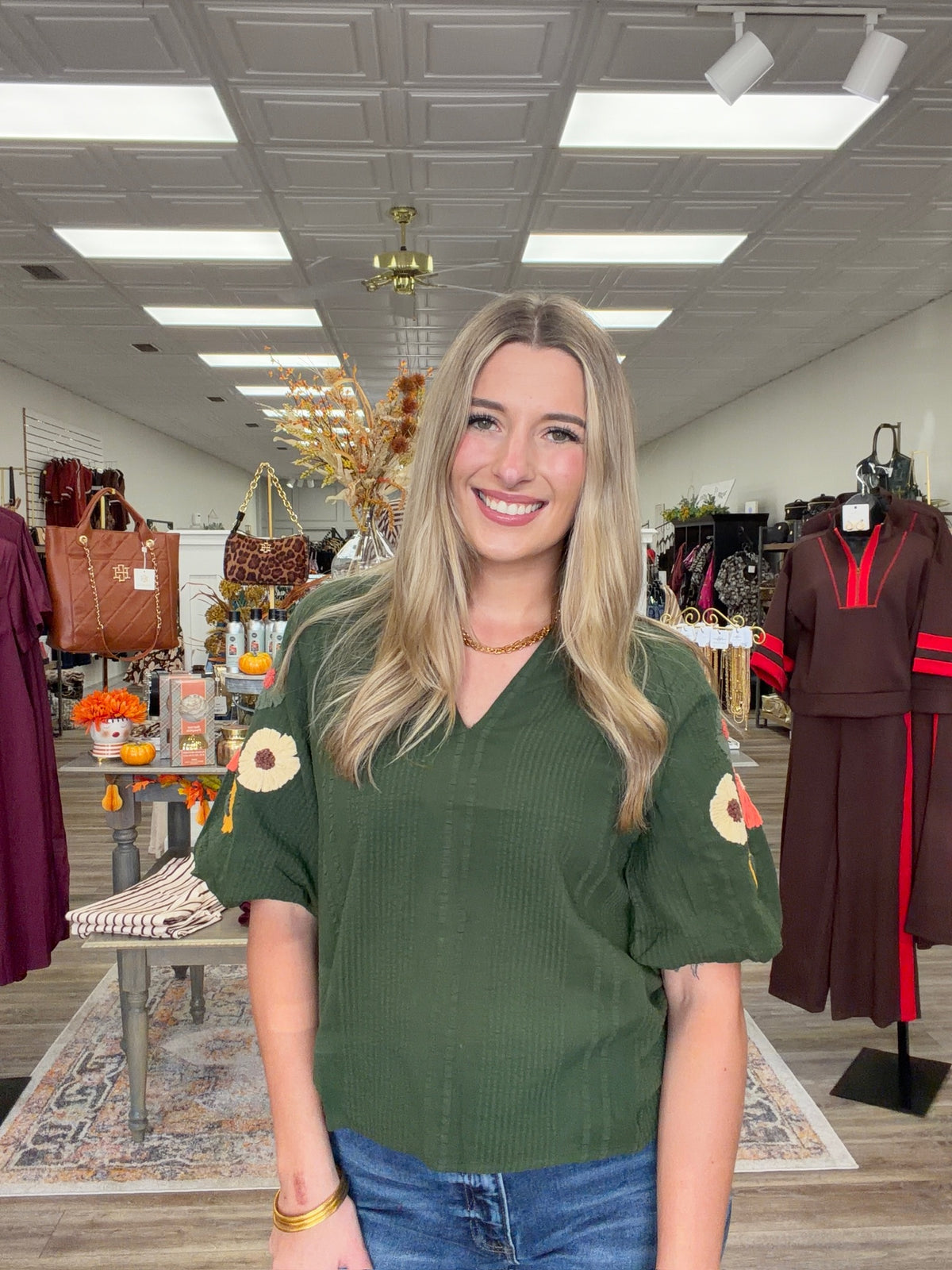 Fall meadow top - rich forest-green textured top featuring statement puff sleeves adorned with colorful dimensional floral details