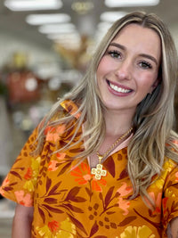 Golden Hour Garden Dress - vibrant mustard floral dress featuring a relaxed silhouette and bold blooms in warm orange, yellow, peach, and chocolate tones.
