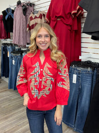 Crimson Plaid Statement Blouse - vibrant red long-sleeve blouse featuring bold plaid appliqué embroidery, a ruffled collar, and button-front detailing