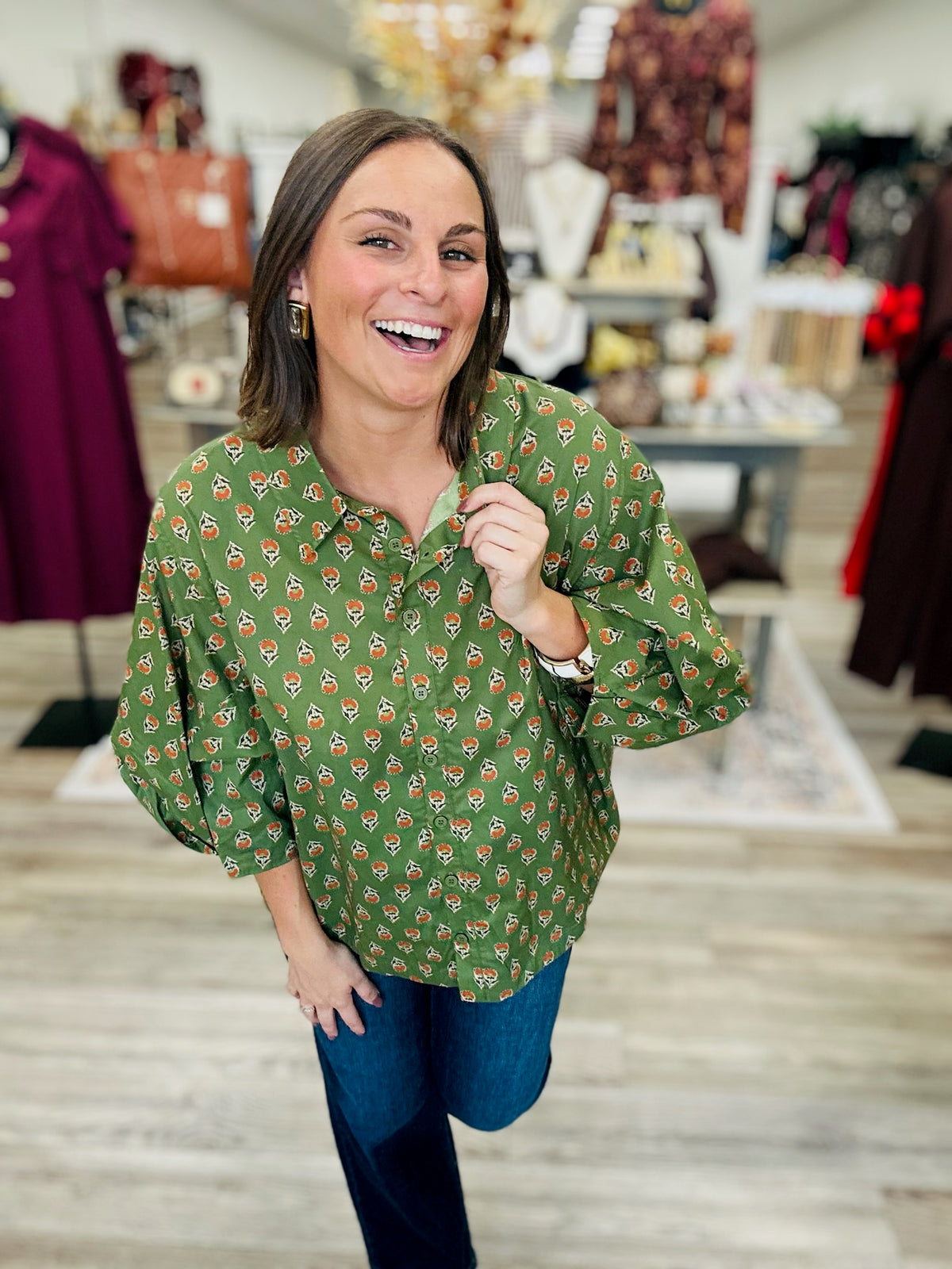 Fall in the Fields Blouse – Olive green blouse featuring a charming orange floral print, classic collar, button-front detailing, and flowy sleeves.