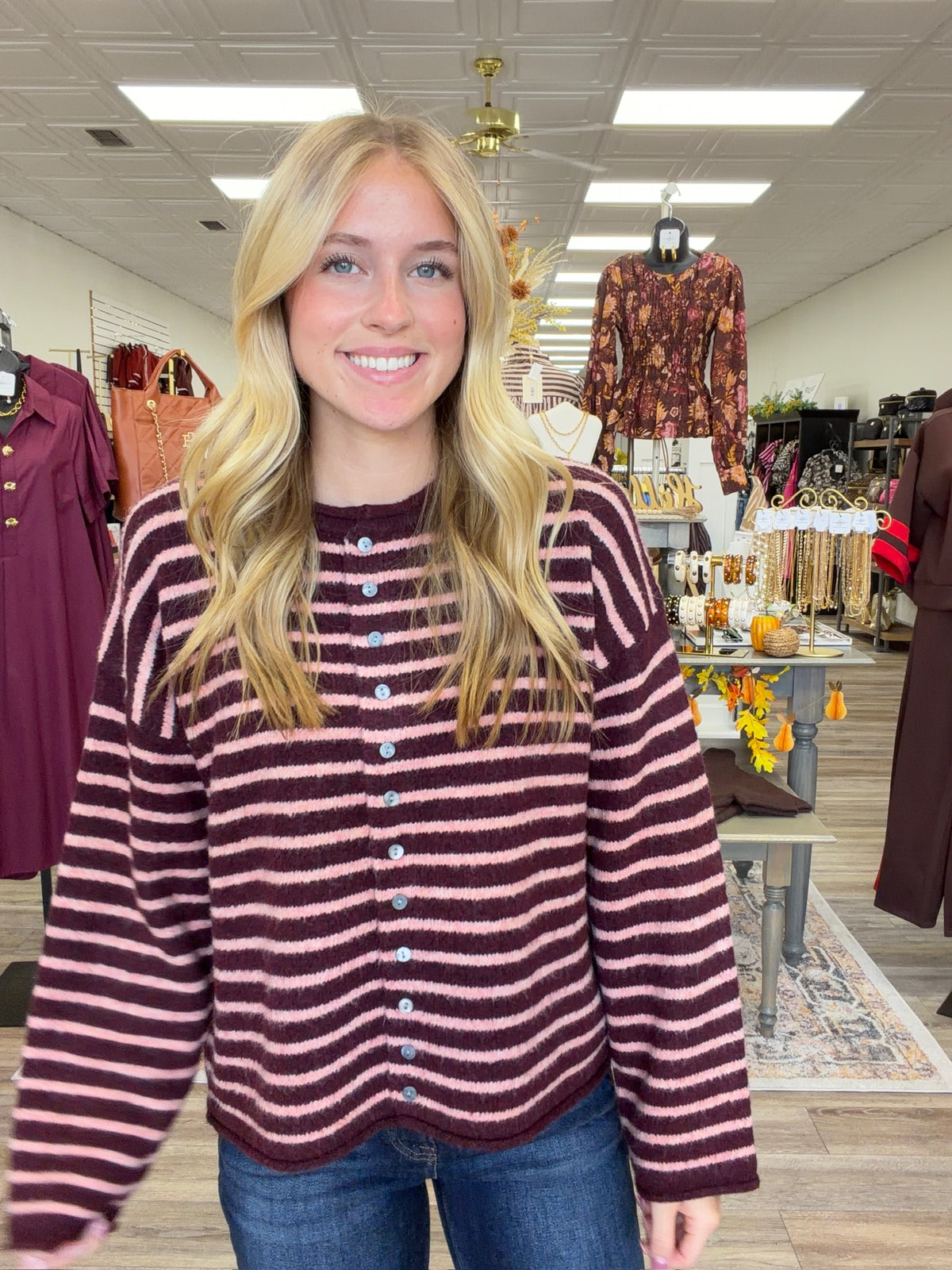 The Blush & Burgundy Cozy Stripe Henley Sweater. This top features ultra soft fuzzy knit fabric, a relaxed, comfortable fit and lightweight warmth for layering.