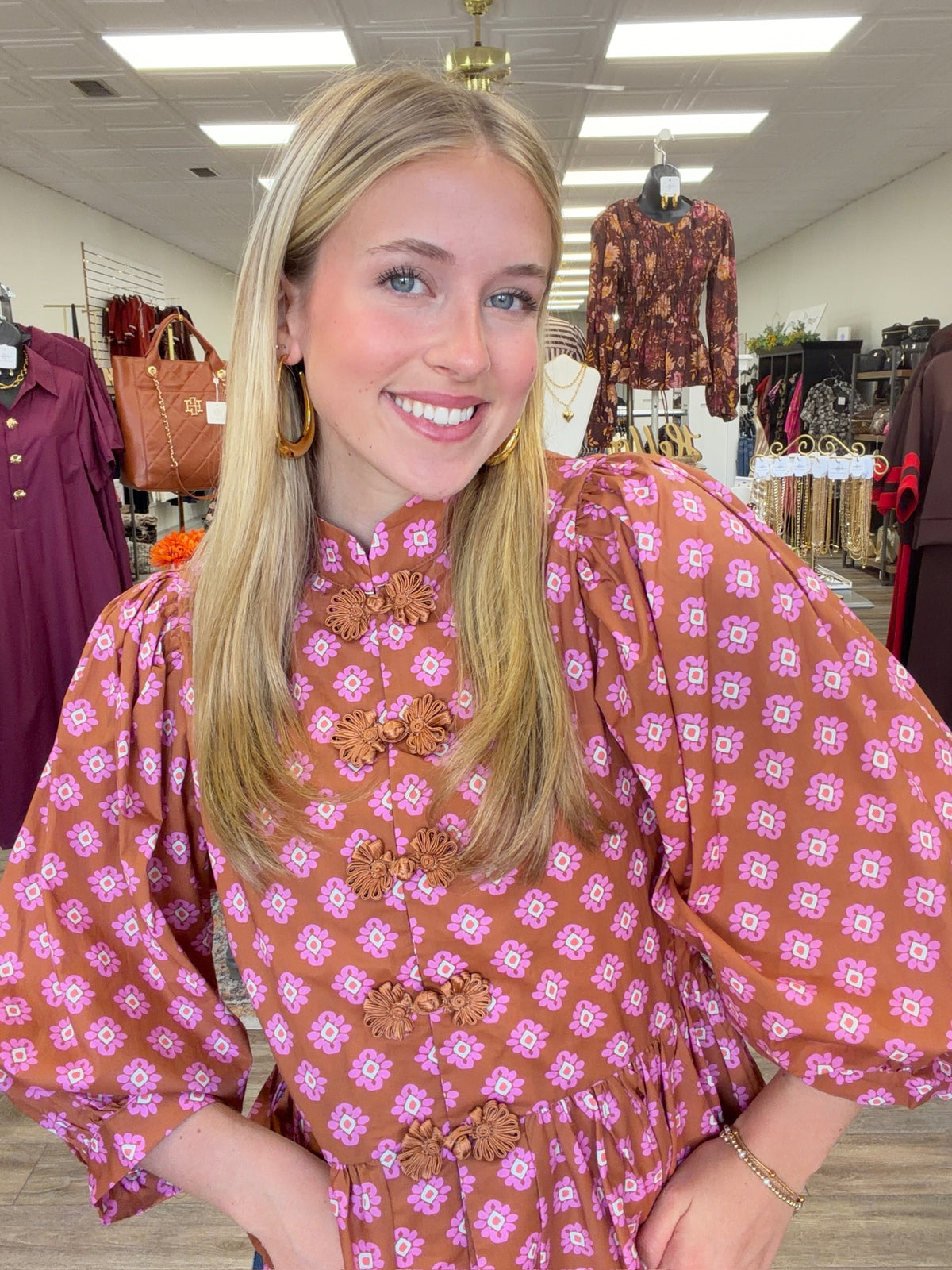 The Katy top - long sleeve, ruffled bottom, and statement button detail