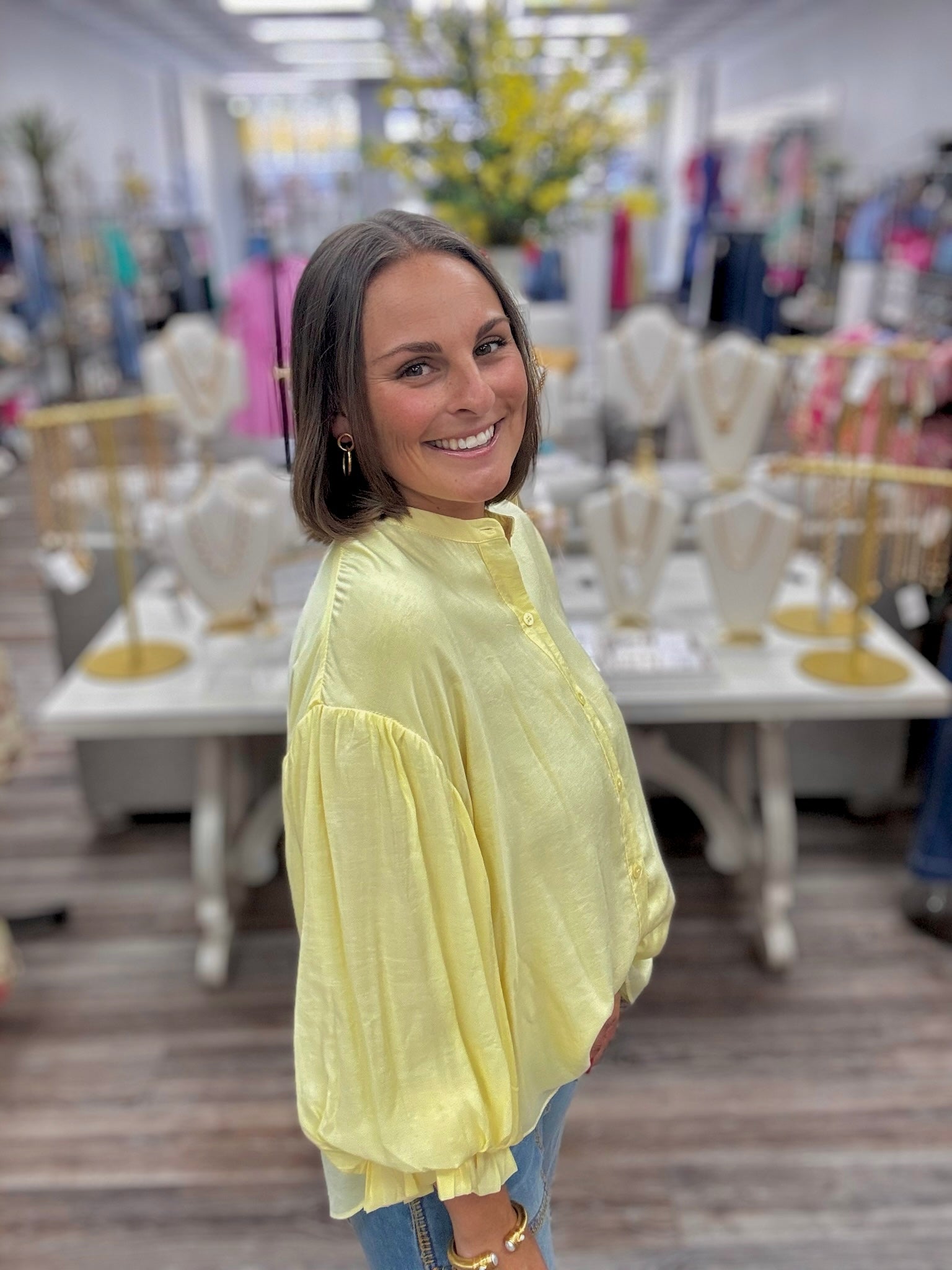 The Joy blouse - A butter-yellow collarless blouse featuring voluminous bishop sleeves, a minimalist button-front placket, and an easy oversized silhouette.