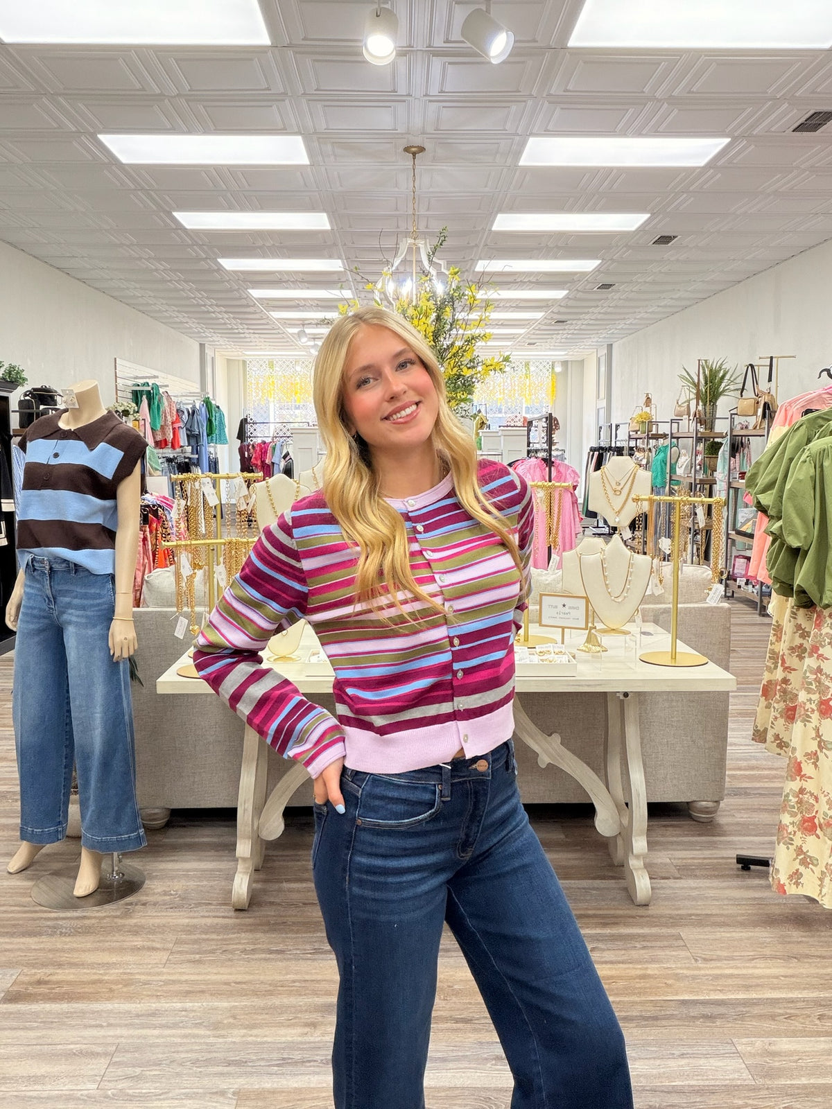 Violet skies cardigan - A lightweight knit cardigan featuring a colorful striped pattern, a classic crew neckline, and a button-front design with a soft, fitted silhouette.