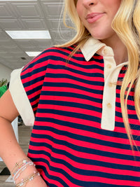 Costal stripe polo - Short-sleeve striped polo top with dark blue and red horizontal stripes, featuring a cream collar and button placket