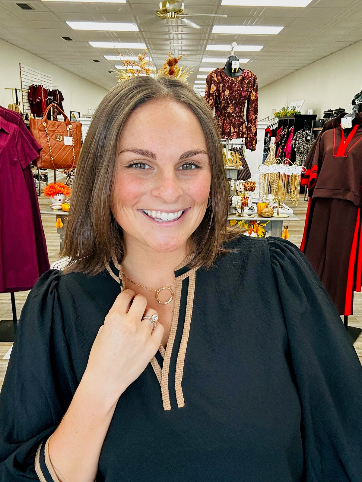 The Blair Top - black blouse featuring puff sleeves and rich camel contrast trim