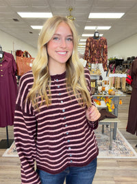 The Blush & Burgundy Cozy Stripe Henley Sweater. This top features ultra soft fuzzy knit fabric, a relaxed, comfortable fit and lightweight warmth for layering.