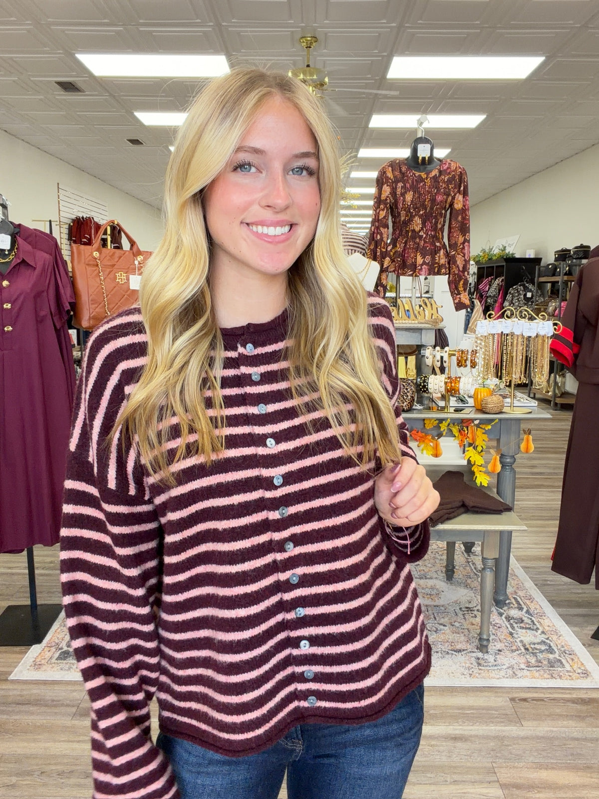 The Blush & Burgundy Cozy Stripe Henley Sweater. This top features ultra soft fuzzy knit fabric, a relaxed, comfortable fit and lightweight warmth for layering.