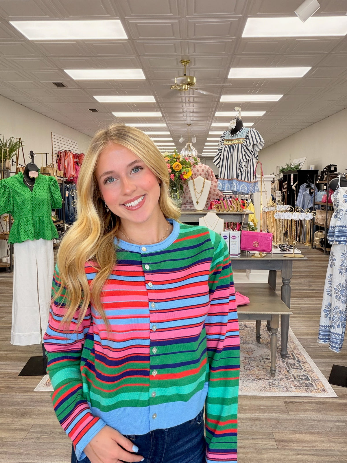Colorful skies cardigan - A lightweight knit cardigan featuring a colorful striped pattern, a classic crew neckline, and a button-front design with a soft, fitted silhouette.