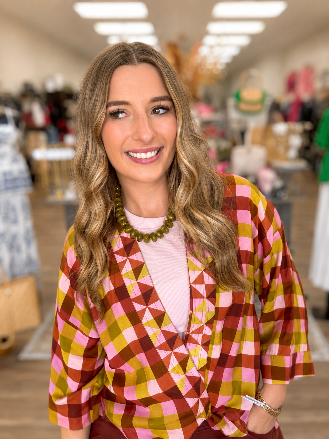 The Madison top - colorful kimono-style top features a vibrant pink, olive, mustard, and rust geometric plaid print, and wide sleeves