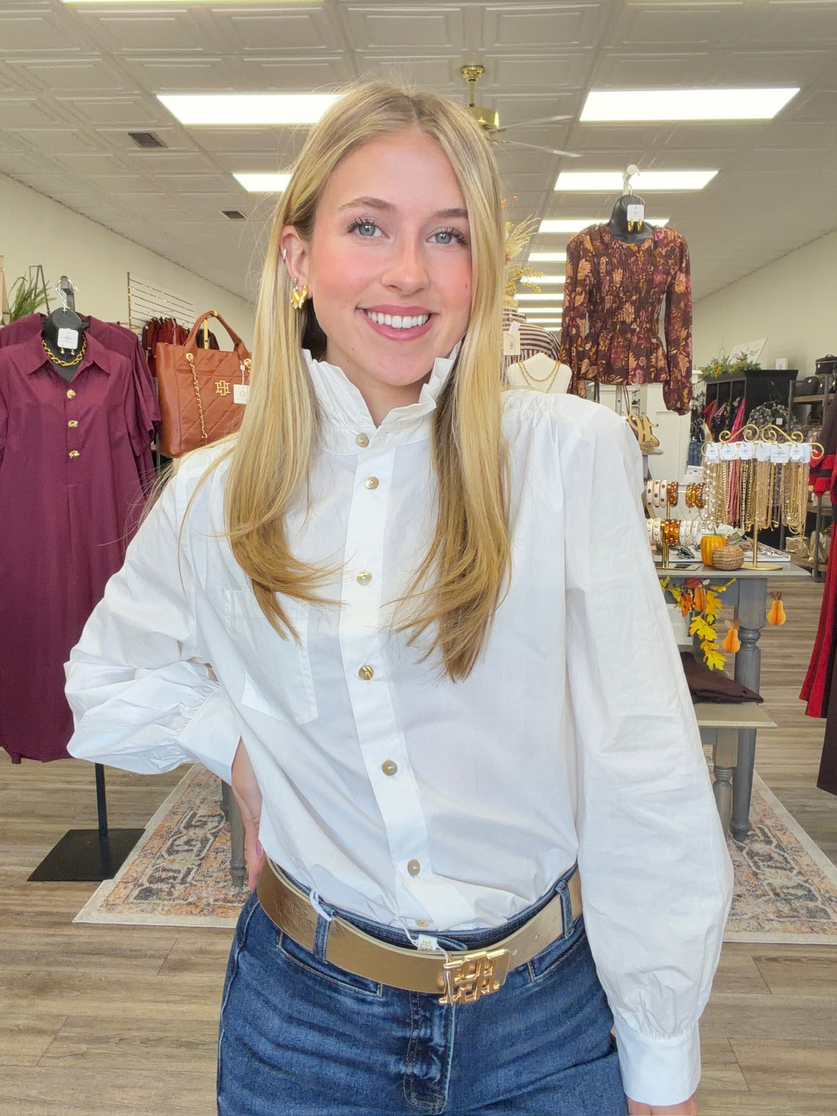 Simply polished top - A white blouse featuring a feminine ruffled neckline, statement sleeves, and classic button-front detailing. 🤍