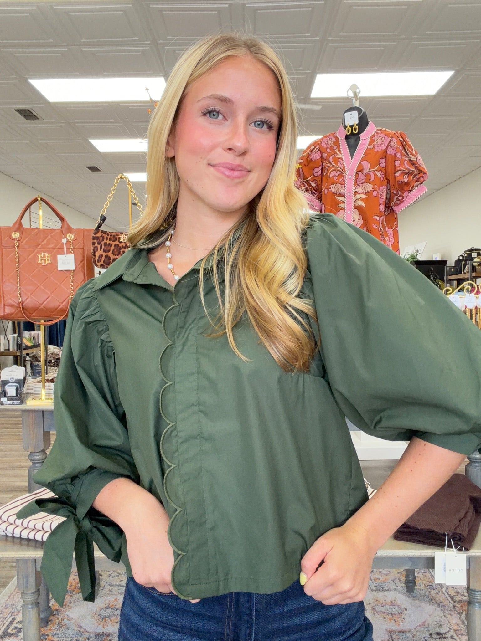The juniper top - Forest green wrap-style blouse with a pointed collar, scalloped trim, and voluminous balloon sleeves with tie cuffs