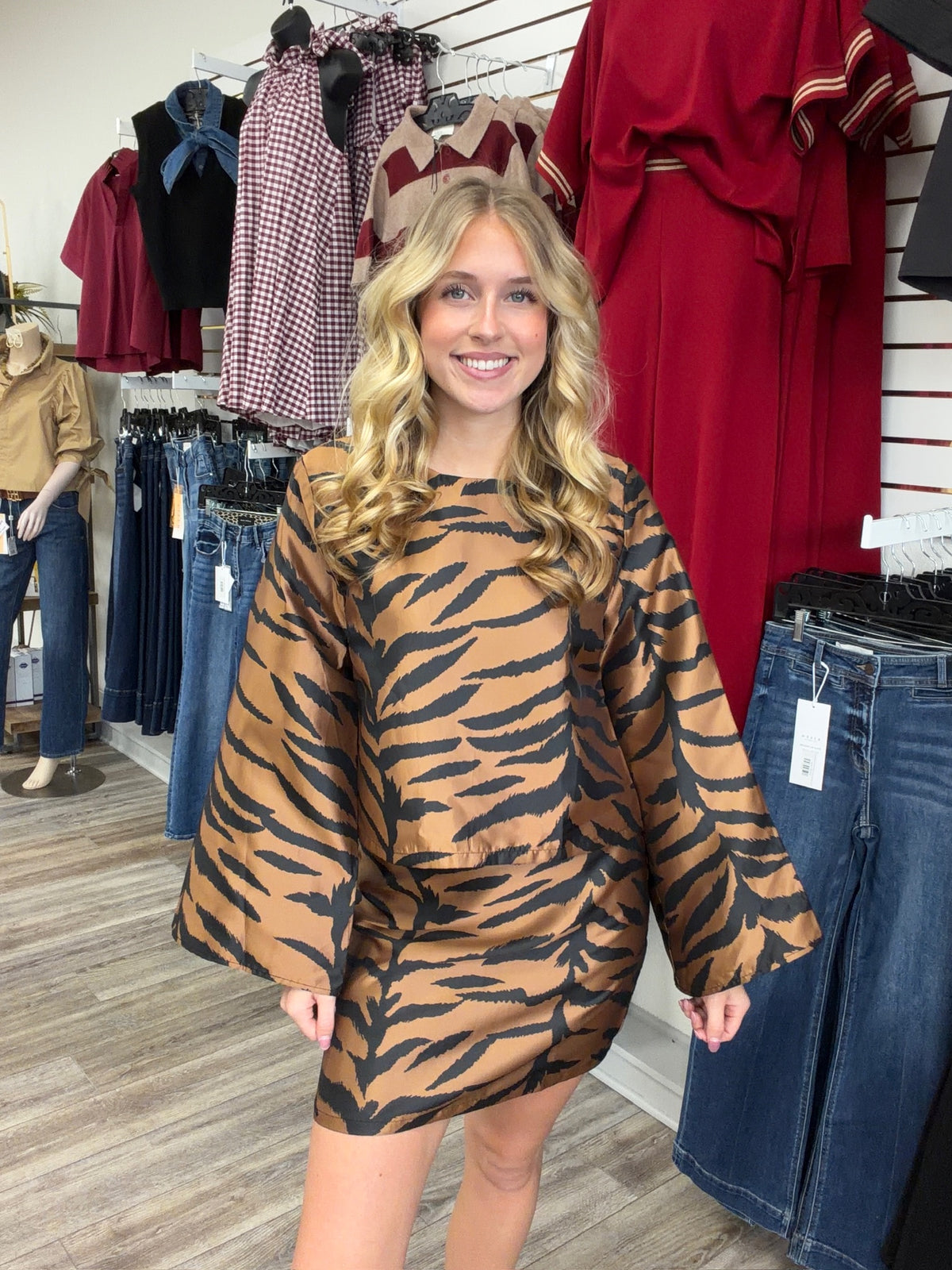 The Wildly chic set tiger print two -piece Set - featuring a warm caramel and black pattern, a relaxed long-sleeve top, and matching skirt