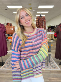 Sunset sorbet cardigan - soft, colorful rainbow-striped knit cardigan featuring a cozy relaxed fit, crew neckline, and button-front closure.