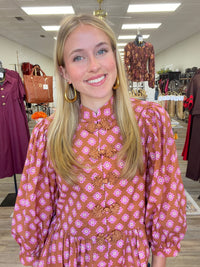 The Katy top - long sleeve, ruffled bottom, and statement button detail
