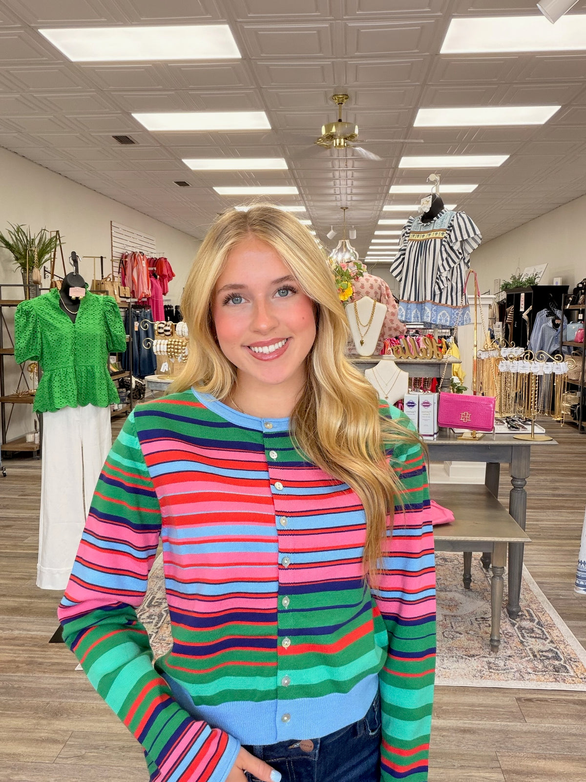 Colorful skies cardigan - A lightweight knit cardigan featuring a colorful striped pattern, a classic crew neckline, and a button-front design with a soft, fitted silhouette.