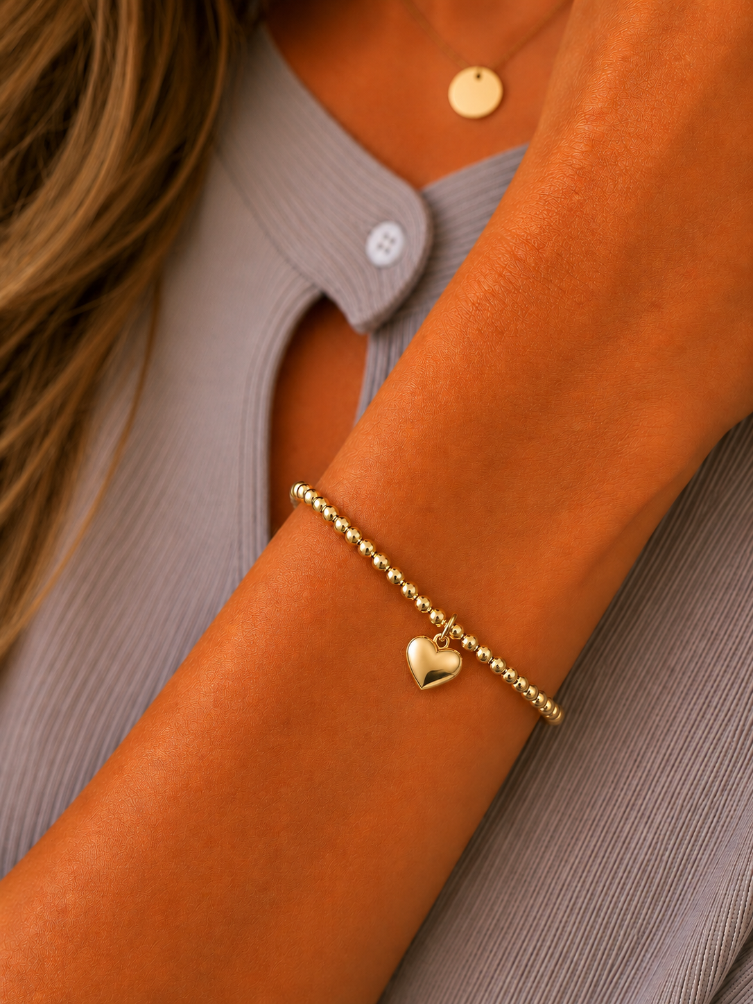 Stretch beaded bracelet with heart pendant accent- steel 18 karat gold overlay