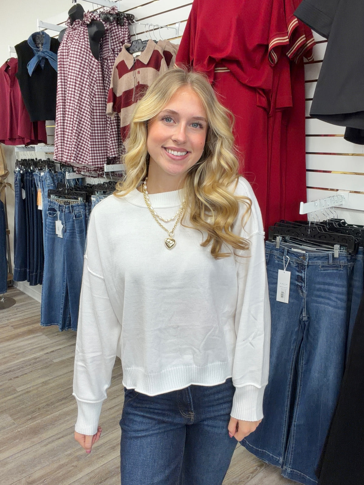The Morgan sweater - white knit sweater, exposed seam detailing, dropped shoulders, and ribbed trim at the neckline, cuffs, and hem