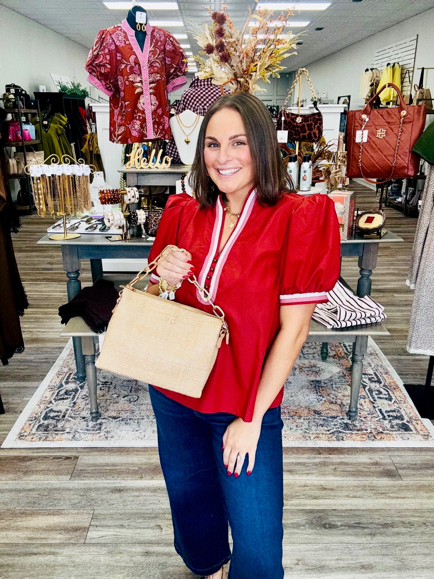 Country side classic - A rich rust red blouse featuring puff sleeves, a split V-neckline with pink and white contrast trim