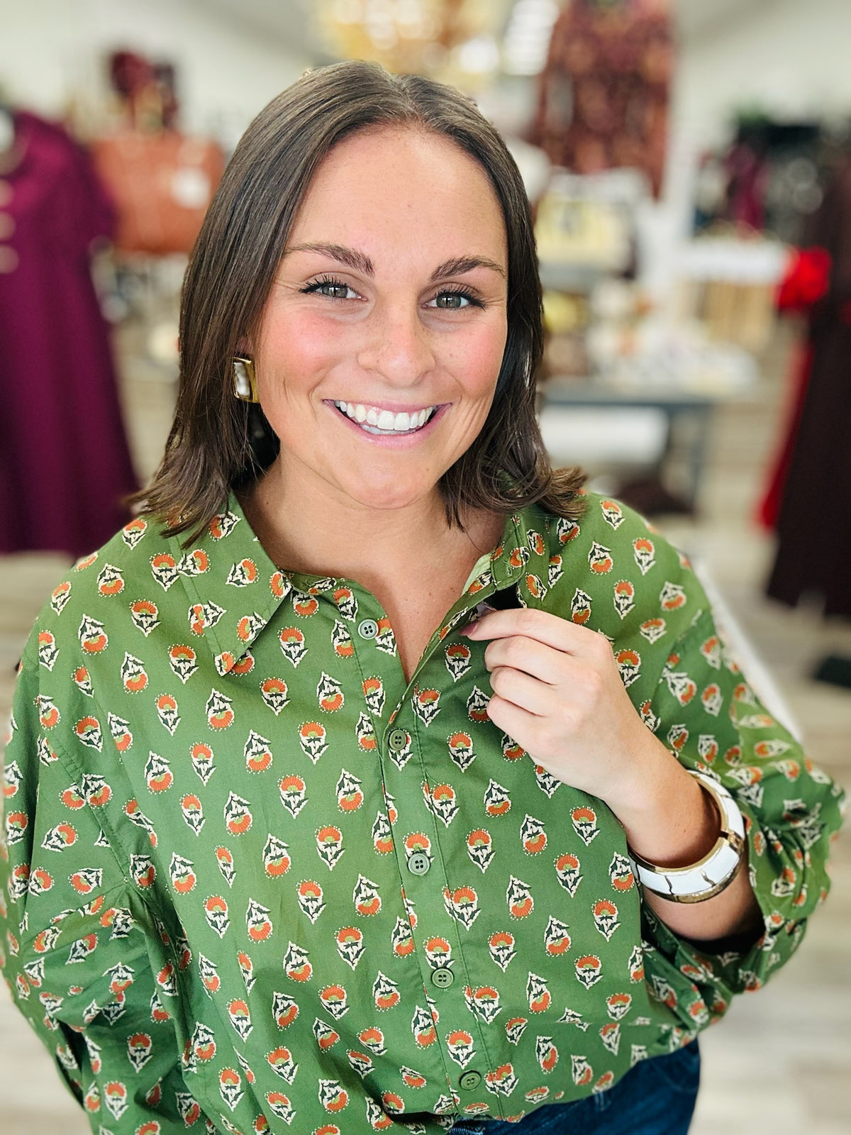 Fall in the Fields Blouse – Olive green blouse featuring a charming orange floral print, classic collar, button-front detailing, and flowy sleeves.