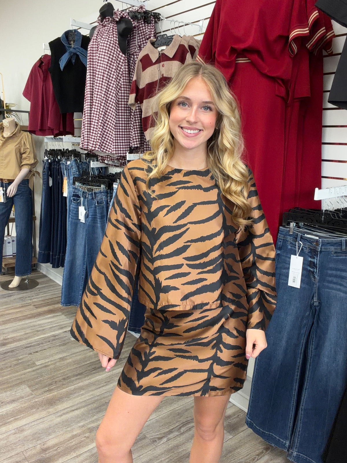 The Wildly chic set tiger print two -piece Set - featuring a warm caramel and black pattern, a relaxed long-sleeve top, and matching skirt