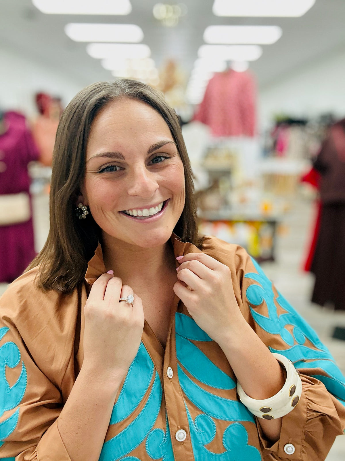 The Jolene dress - This camel-brown dress features beautiful turquoise appliqué detailing on the front, 3:4 sleeve