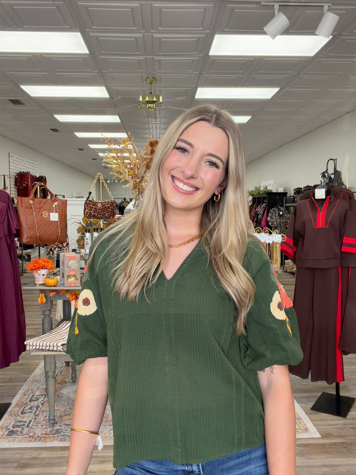 Fall meadow top - rich forest-green textured top featuring statement puff sleeves adorned with colorful dimensional floral details