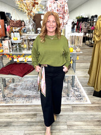The Morgan sweater - Olive knit sweater, exposed seam detailing, dropped shoulders, and ribbed trim at the neckline, cuffs, and hem