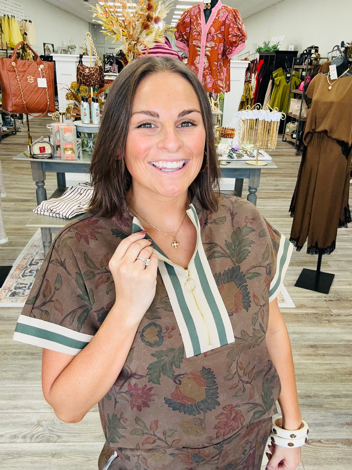 Vintage Garden Luxe Set featuring a soft, stretchy printed dark mocha knit fabric with a smooth, luxurious feel, mock neckline, and a relaxed short sleeve half zip top with striped ribbon detailing