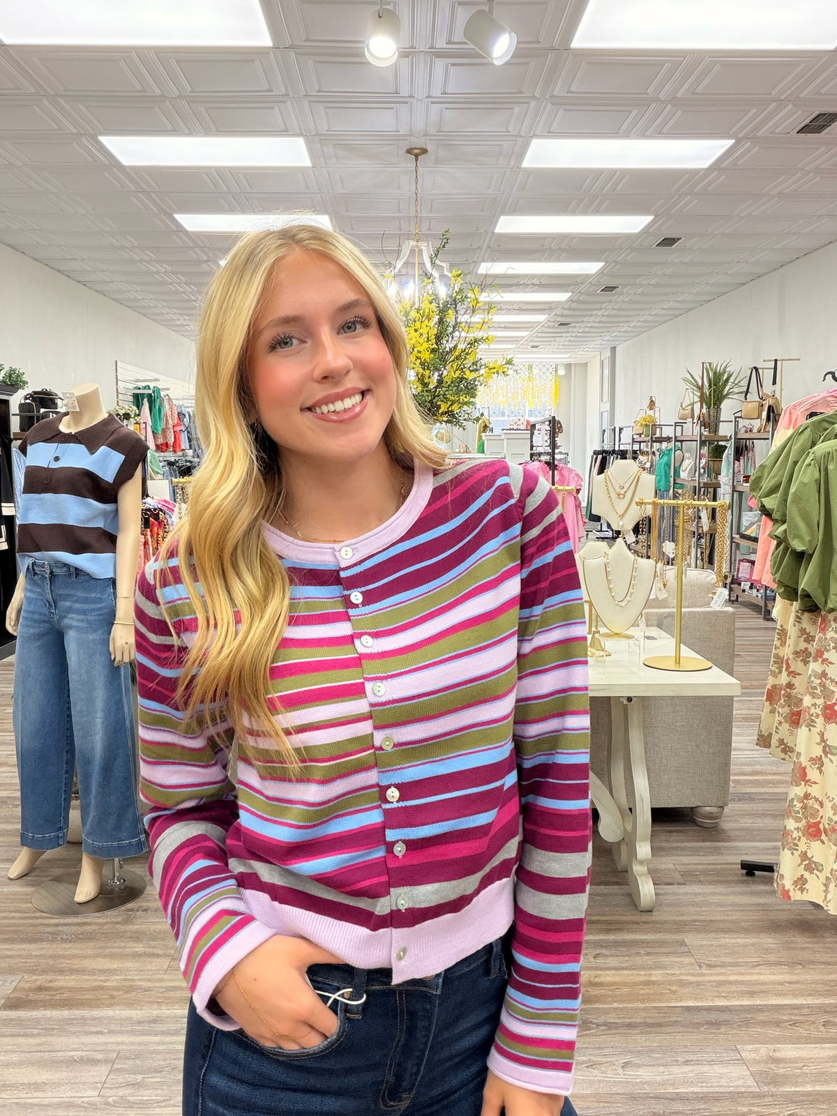 Violet skies cardigan - A lightweight knit cardigan featuring a colorful striped pattern, a classic crew neckline, and a button-front design with a soft, fitted silhouette.