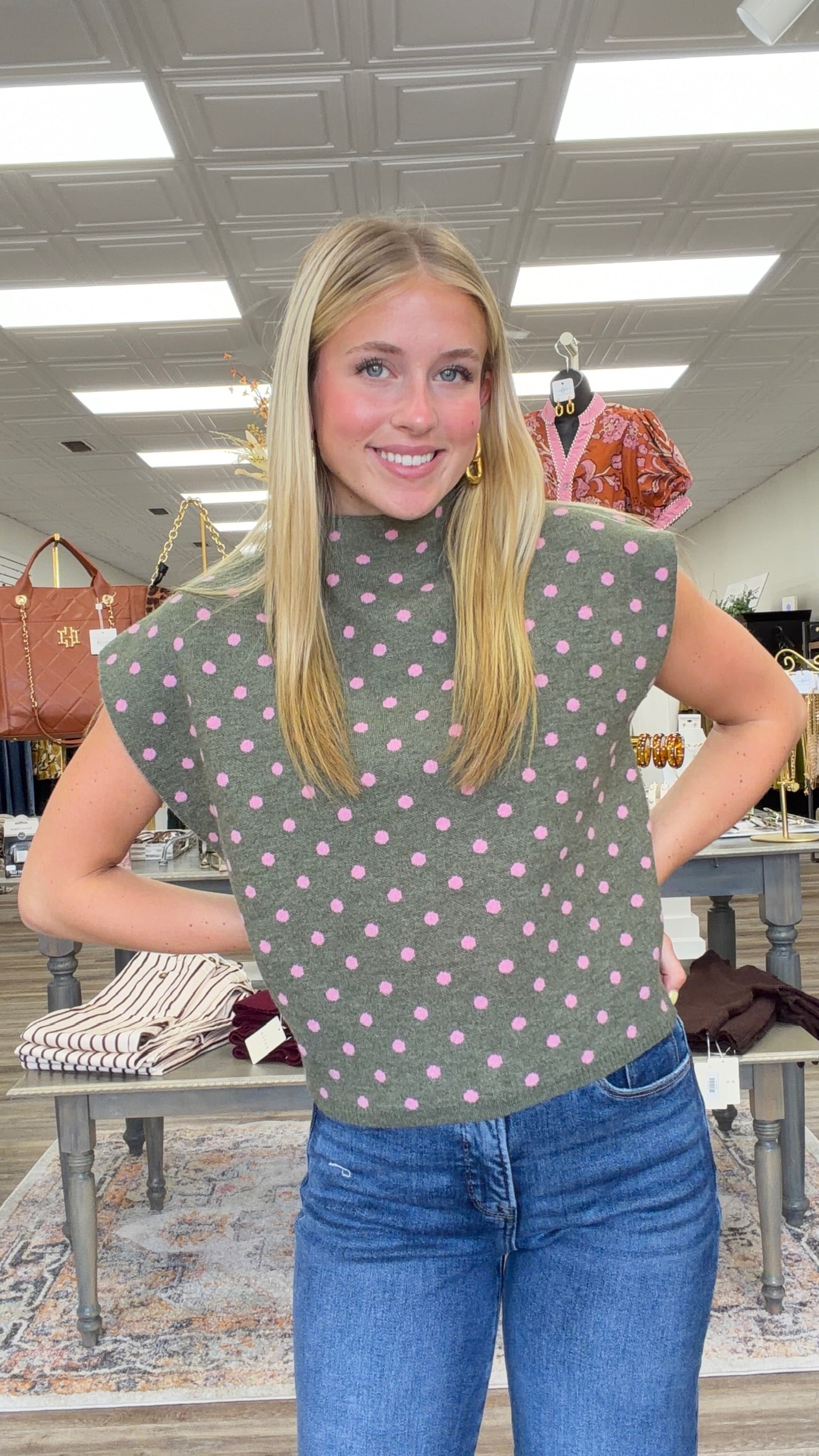 The Evie sweater - Olive knit short-sleeve sweater top with pink polka dots, featuring a high crew neckline, relaxed boxy fit, and lightweight sweater-knit construction. Entro